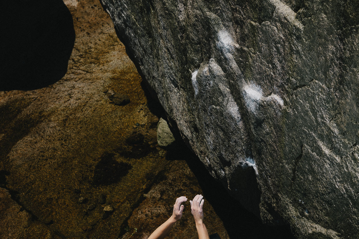Heidi Genesis mimes the moves on First Love (V4) at the Riverbed Boulders in Bukansan National Park, South Korea