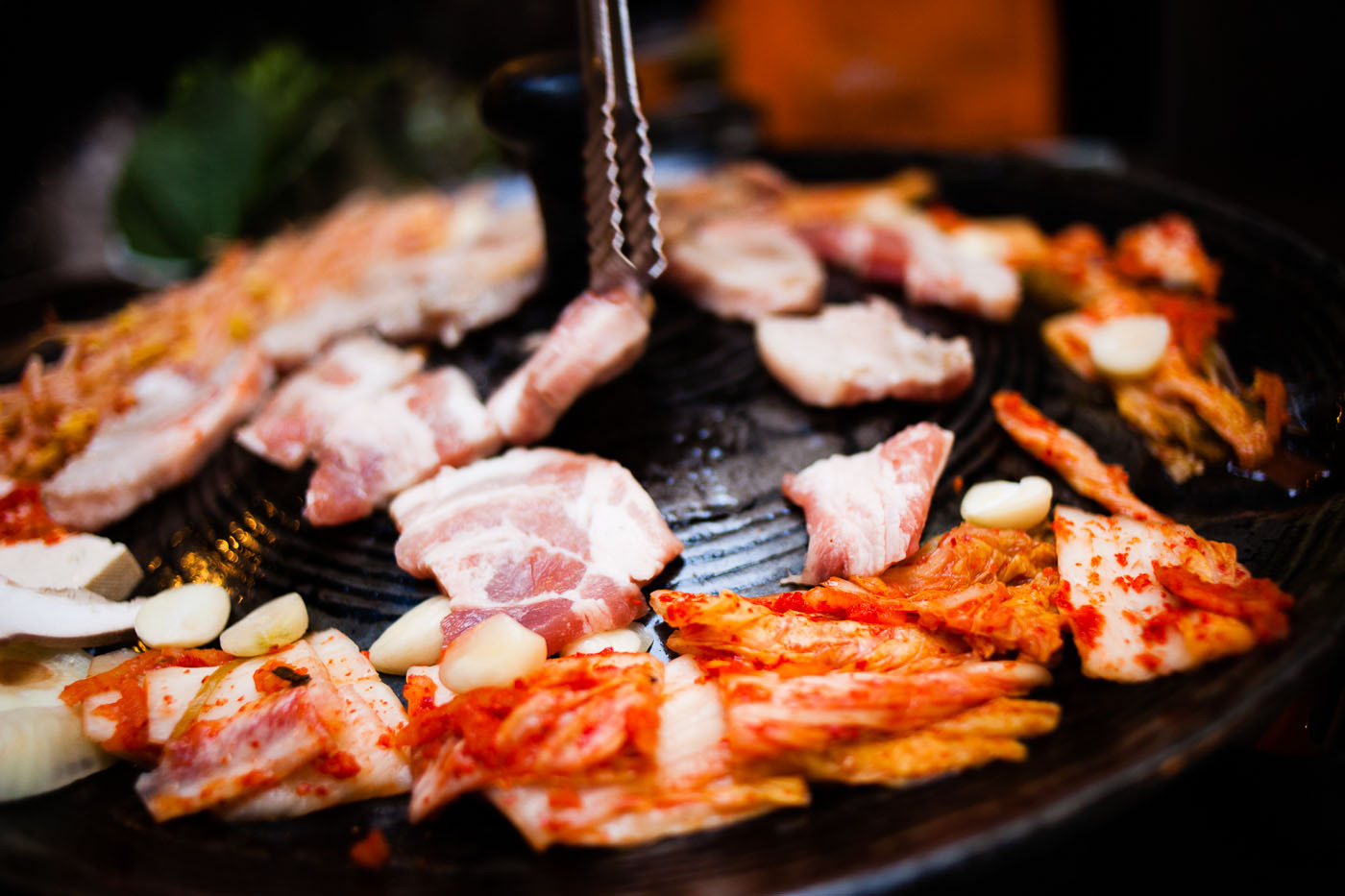 Cooking samgyeopsal at a restaurant in Seoul, South Korea