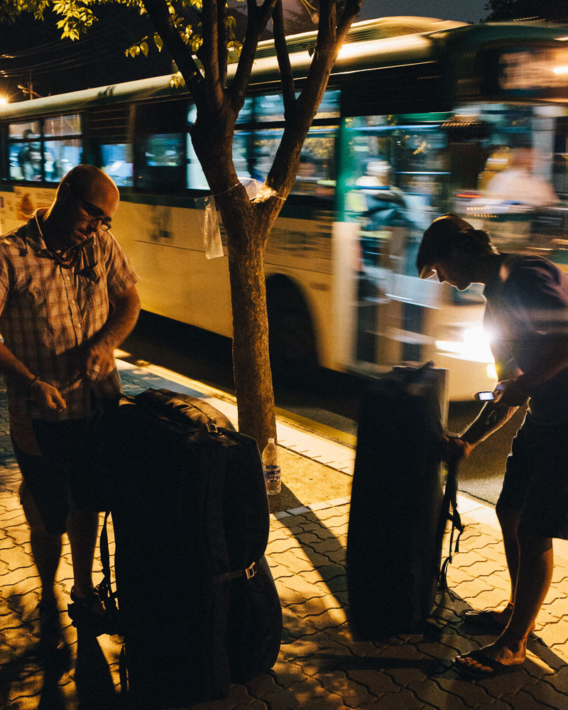 Dave McAllister and Paul Lammens wait for the bus after bouldering in Seoul, South Korea