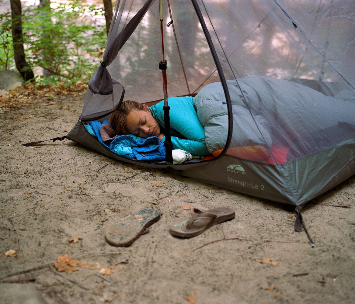 Emily Ayres in a tent on a backpacking trip down the Narrows, Zion National Park, Utah
